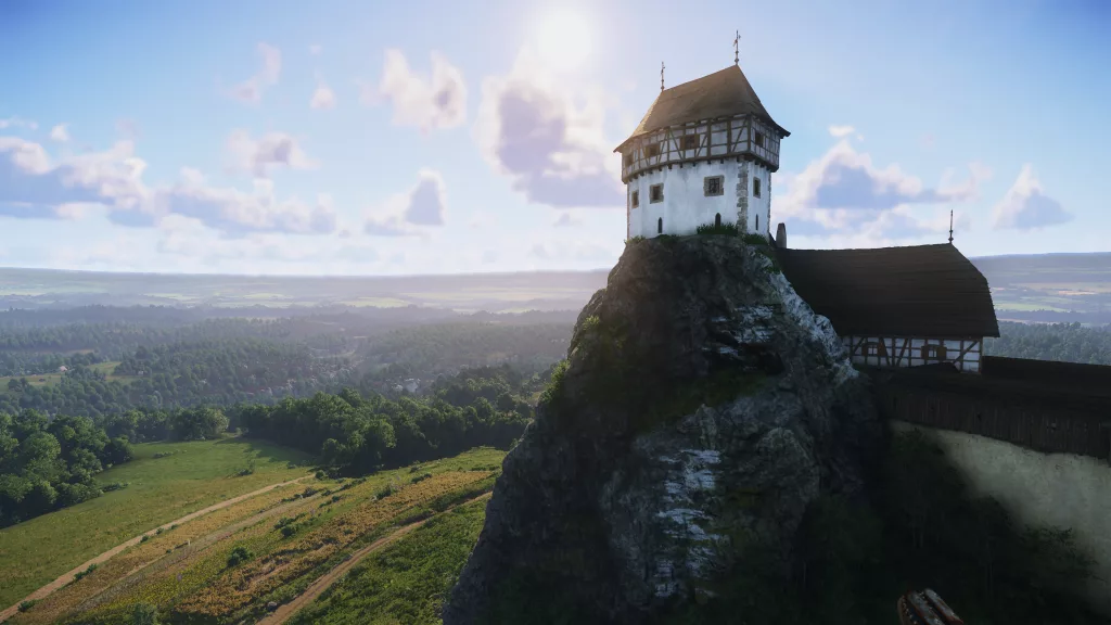 Uma paisagem de uma casa em cima de uma pequena montanha com vista pra uma grande planície verdejante.